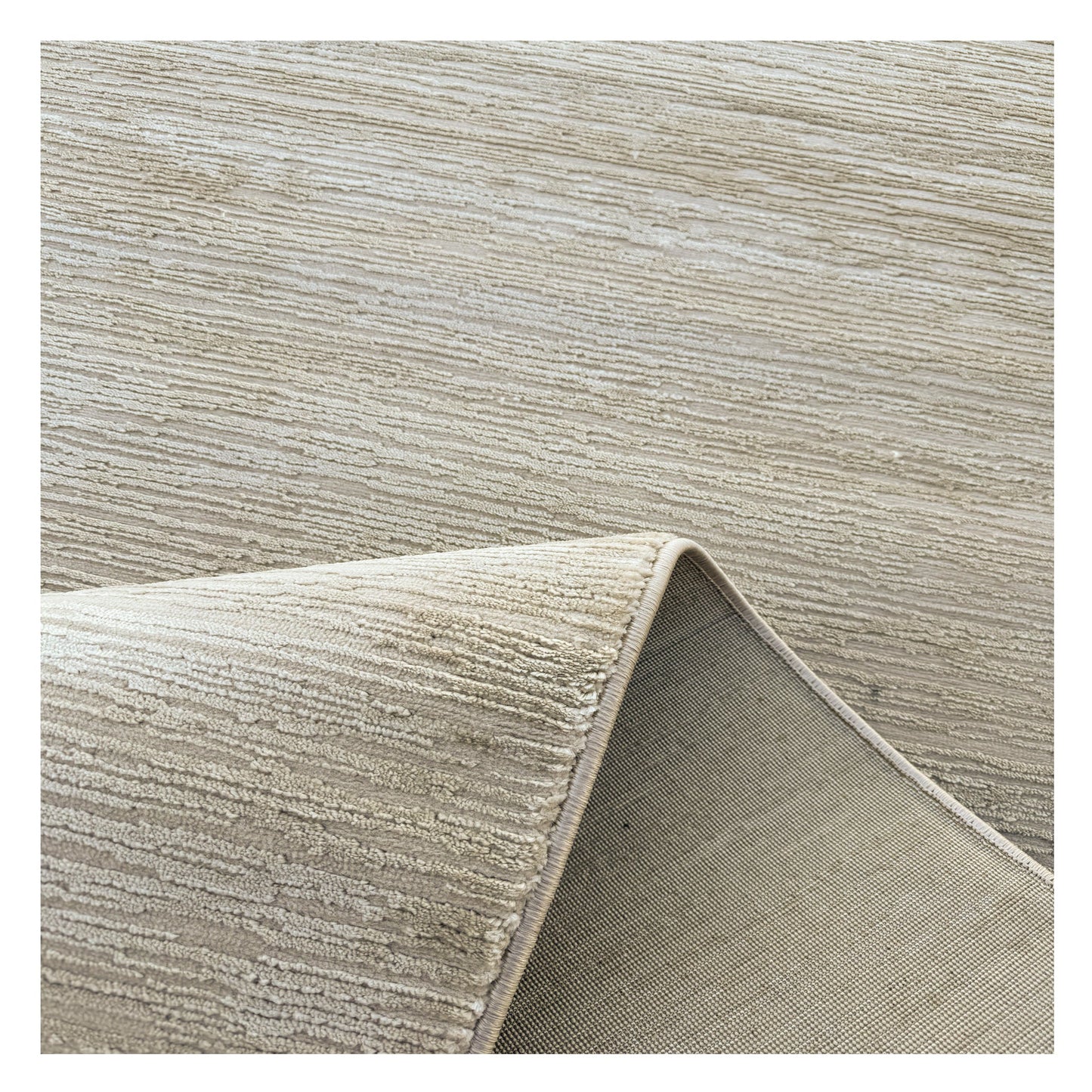 Loft Light Beige Rug styled in a bright coastal bedroom