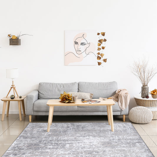 Clouds Area Rug in a autumn inspired neutral minimalist living room with grey sofa, wooden and rattan accent tables 