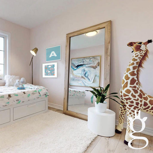 Bright kids room with Ecru Shag Rug, large mirror, white stool and huge giraffe toy
