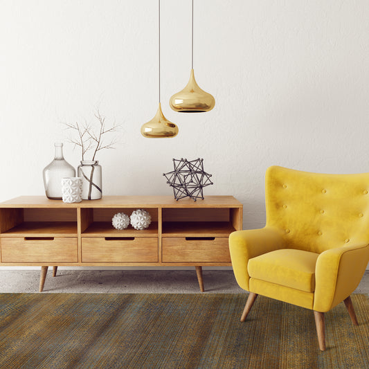 Modern living room with Mystic Green Rug, bright yellow armchair, teak buffet, brass lamps