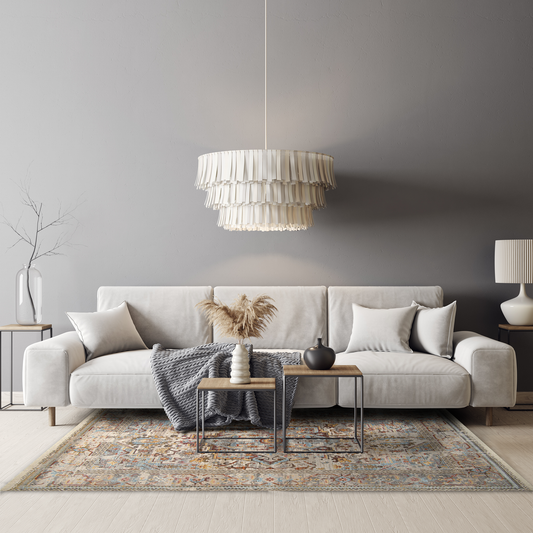 Modern grey minimalist living with off-white large sofa, chandelier, wooden accent tables and Mystic Earthy Rug