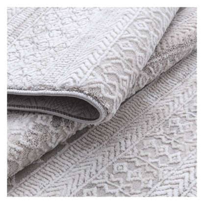 Folded Tribal Ivory Rug with tufted tribal motifs