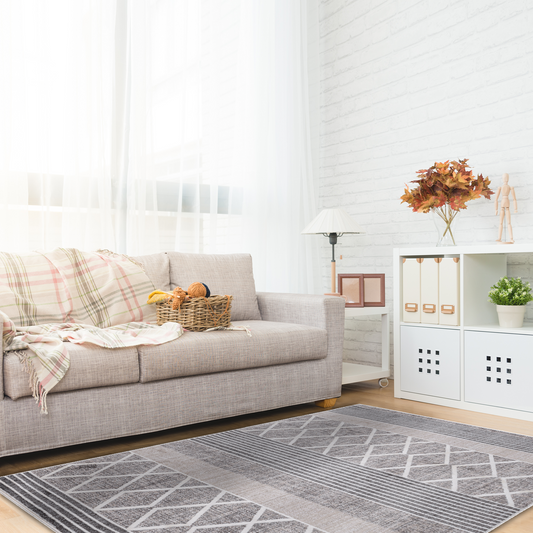Bright family room with beige sofa, autumn decor and Smyrna Dune Rug